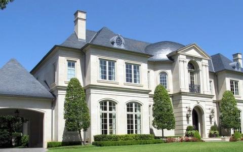 A mansion with many rooms and a big garage