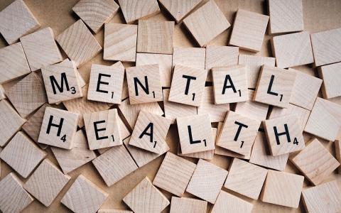 scrabble blocks spelling out Mental Health