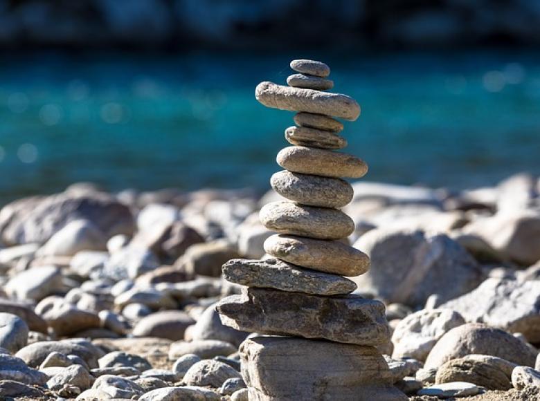 A group of rocks balanced on one another on a rocky beach