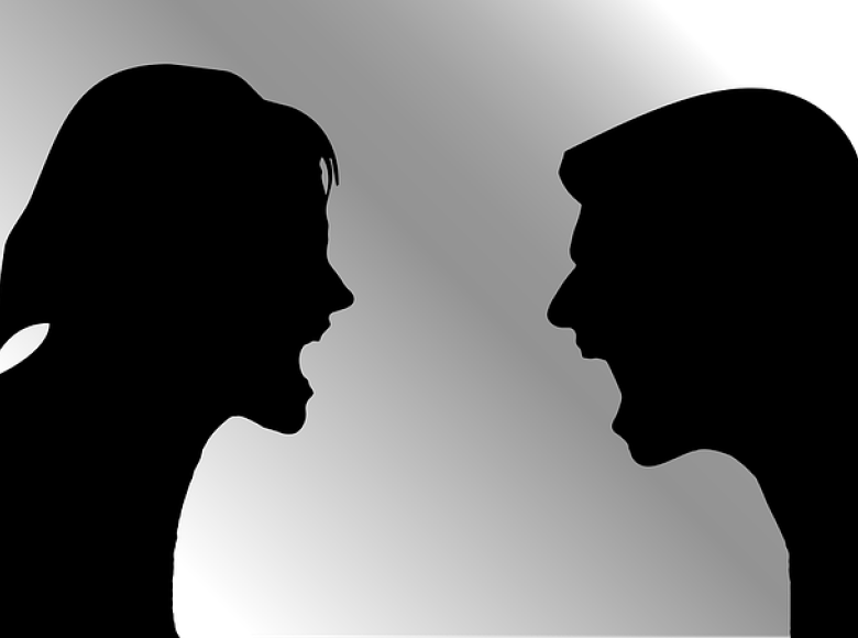 A woman and man arguing with each other
