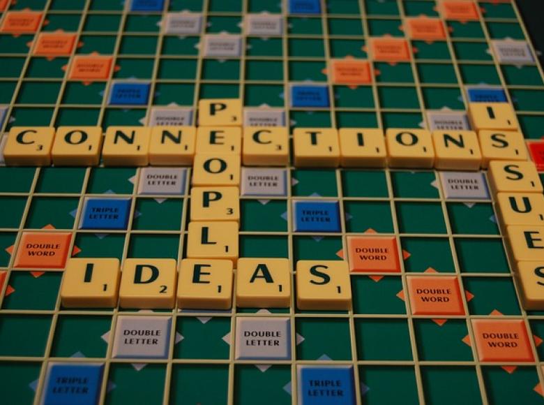 Scrabble board with key words around connections