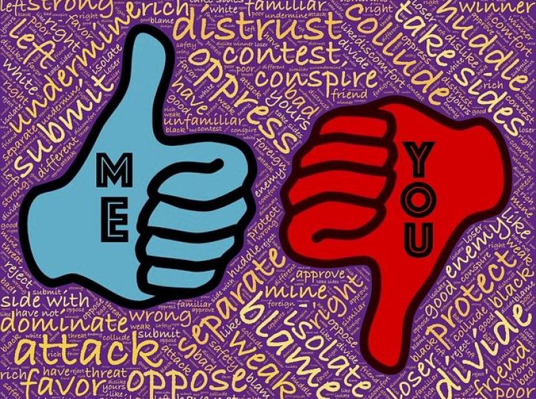 A blue thumbs up "me" and red thumbs down "them" 