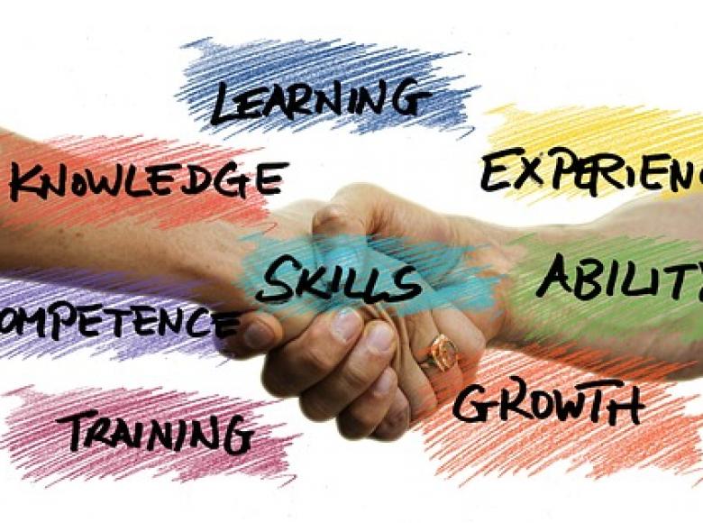 Shaking hands with key words related to skills