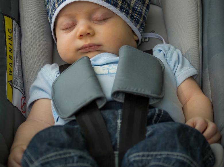 Baby sleeping soundly in a car seat